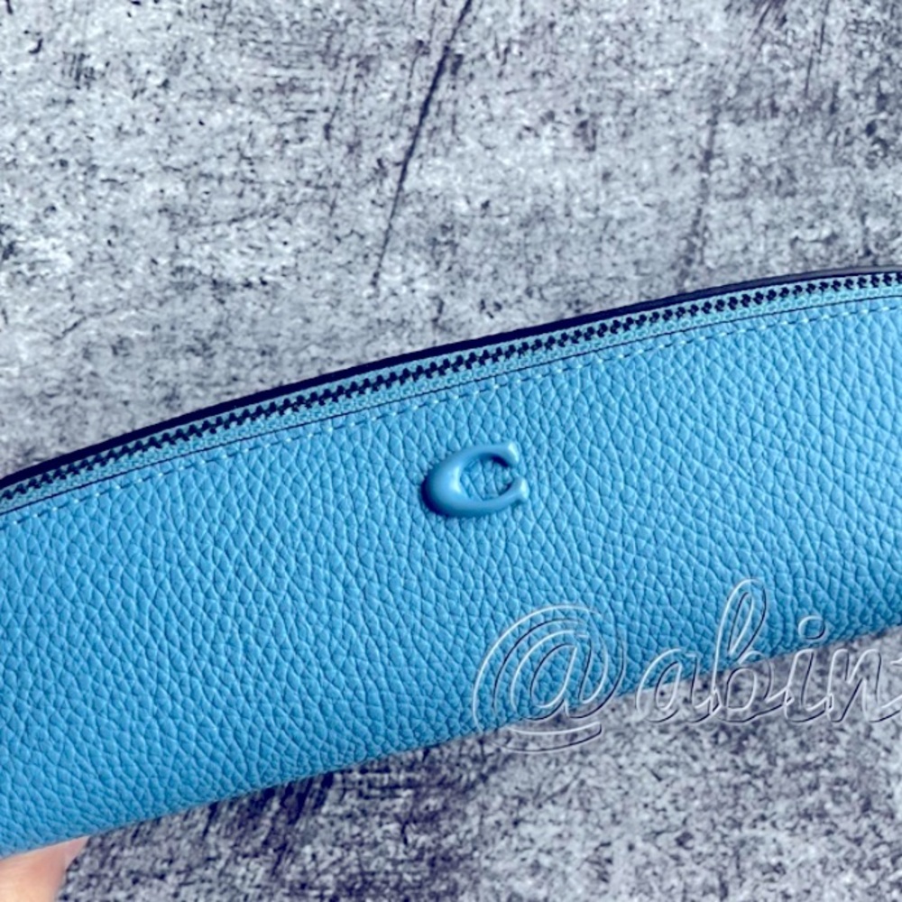 In search of This Coach pencil case in this color or green
